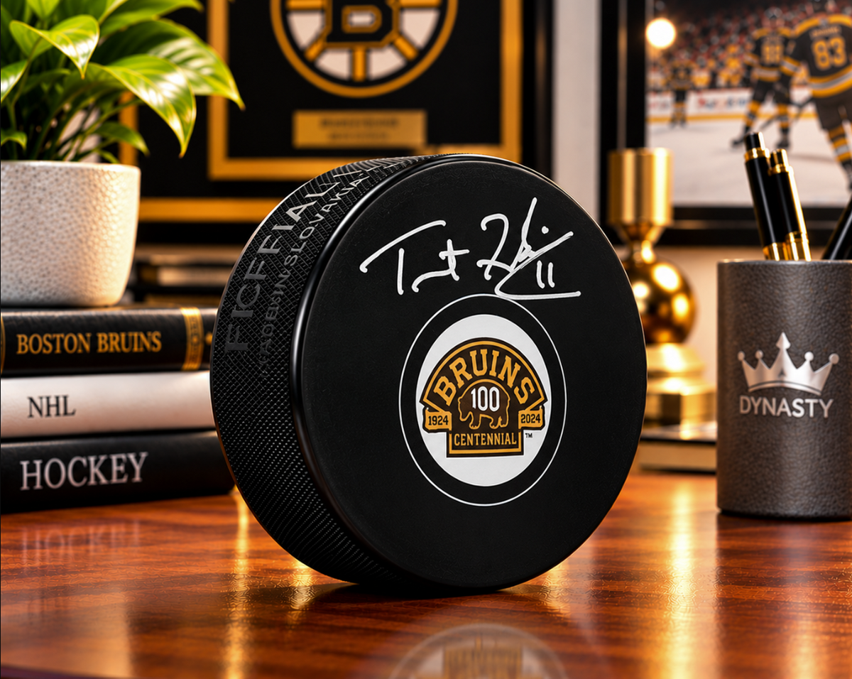Trent Frederic Autographed Boston Bruins 100th Anniversary Hockey Logo Puck