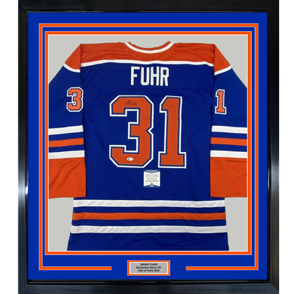 Framed Autographed/Signed Grant Fuhr 35x39 Edmonton Blue Hockey Jersey Beckett BAS COA